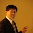 Dr.Liu giving a lecture, speaking with enthusiasm